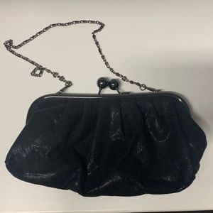 Black, shiny mini clutch with shoulder strap